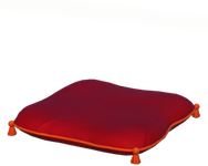 Rotes Kissen mit Quasten